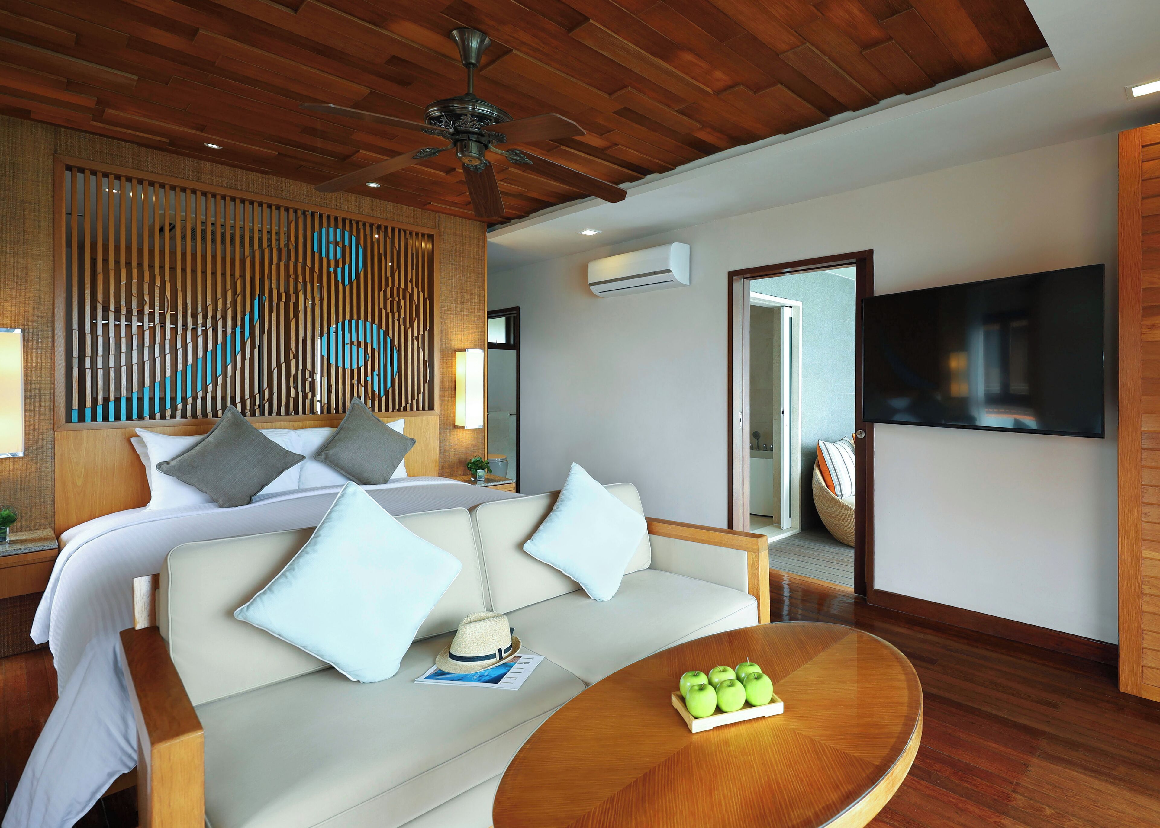 premier suite on water | living area | 32-inch flat-screen tv with satellite channels, tv, ping pong