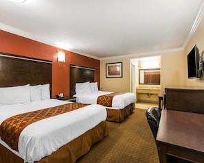 Premium bedding, desk, laptop workspace, blackout curtains