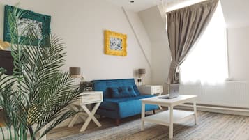Suite | Tabla de planchar con plancha, wifi gratis y ropa de cama