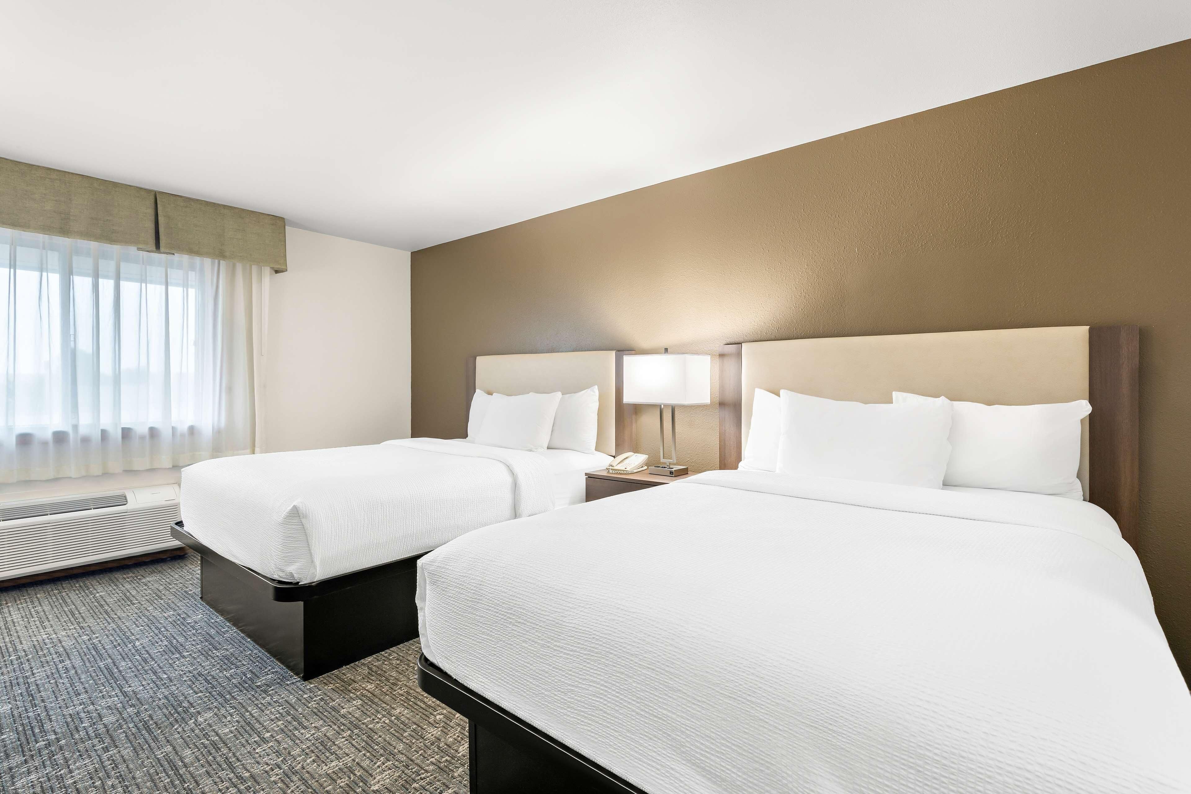 Premium bedding, pillow-top beds, in-room safe, desk