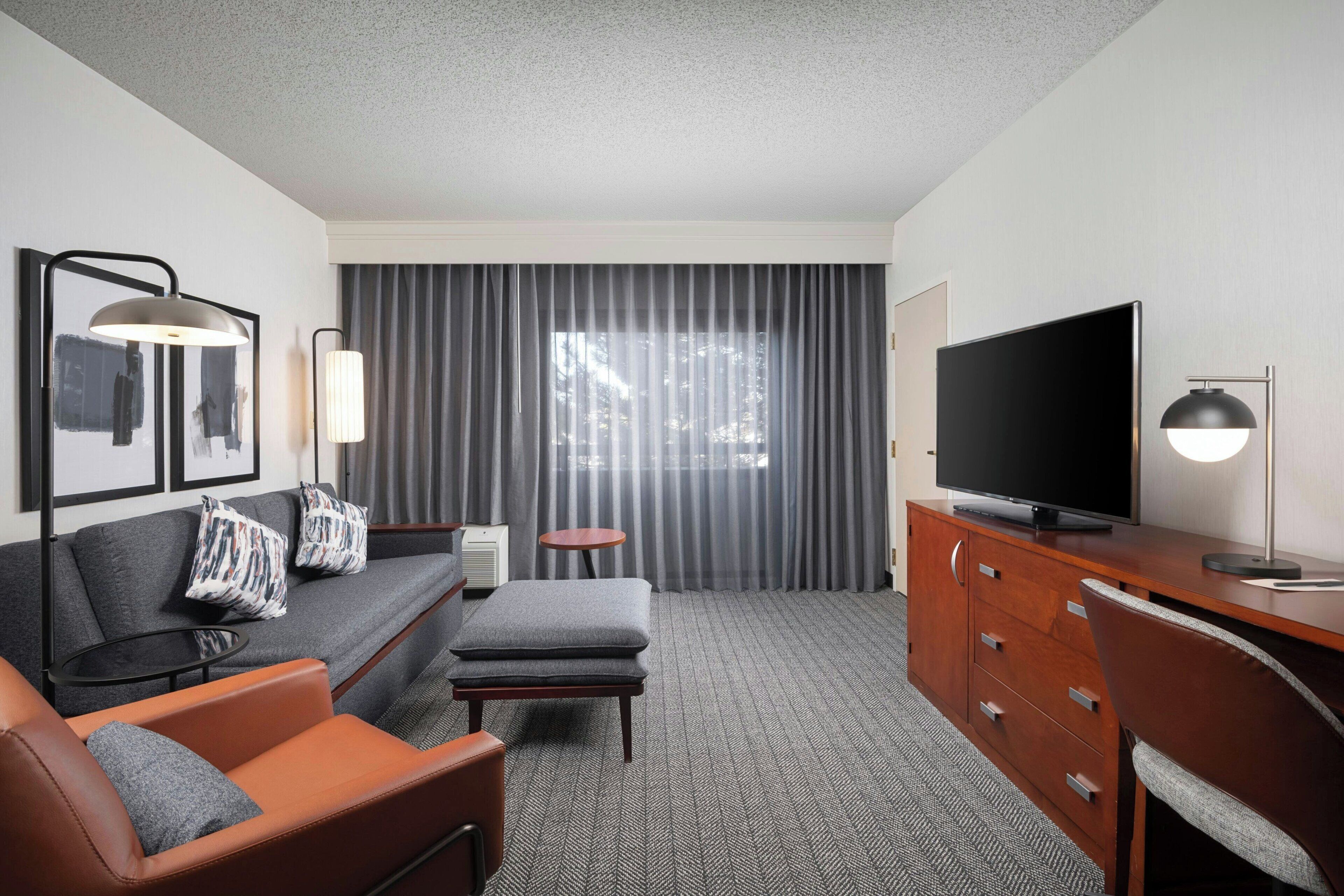 Suite, 2 Double Beds | Living area | 42-inch flat-screen TV with cable channels, TV, Netflix