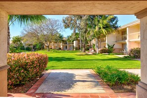 Guests can relax in the serene courtyard, surrounded by lush greenery and a tranquil water feature.