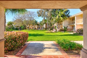 Guests can relax in the serene courtyard, surrounded by lush greenery and a tranquil water feature.