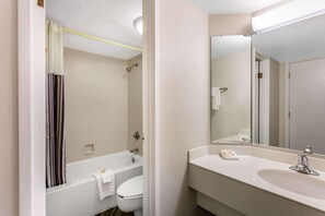 A bathroom with a bathtub, toilet, and sink. - La Quinta Inn by Wyndham Odessa (Odessa)