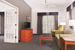 Suite, 1 King Bed, Non Smoking | Premium bedding, desk, blackout curtains, iron/ironing board
