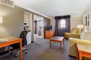 Suite, 1 King Bed, Non Smoking | Premium bedding, desk, blackout drapes, iron/ironing board