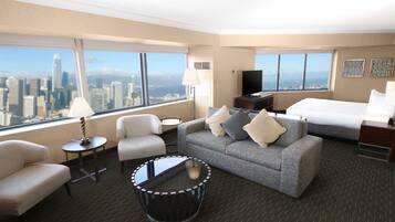 Deluxe Corner King Junior Suite | Living area | 37-inch flat-screen TV with satellite channels, TV