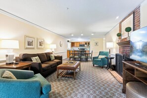 Deluxe One Bedroom Condo | Living area | 42-inch flat-screen TV with cable channels, TV