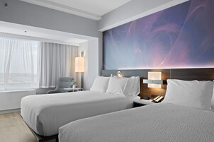 Hypo-allergenic bedding, desk, laptop workspace, blackout drapes