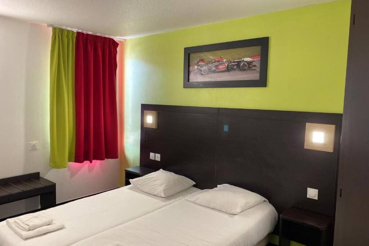 Premium bedding, laptop workspace, blackout curtains, soundproofing