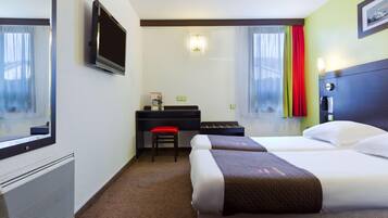 Premium bedding, laptop workspace, blackout curtains, soundproofing