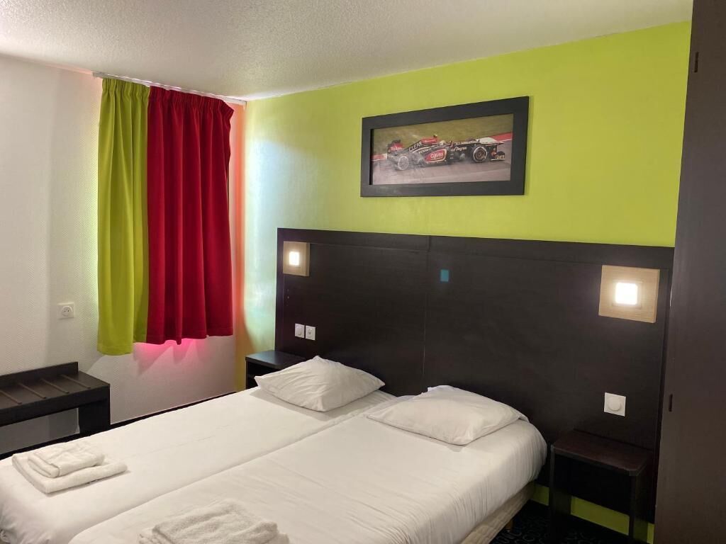 Premium bedding, laptop workspace, blackout drapes, soundproofing