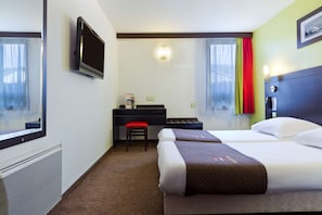Premium bedding, laptop workspace, blackout curtains, soundproofing