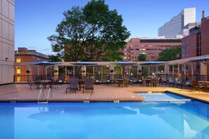 Seasonal outdoor pool, open 10:00 AM to 9:00 PM, pool umbrellas