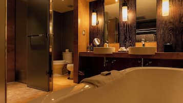 Suite, 1 King Bed | Bathroom | Combined shower/tub, hair dryer, towels
