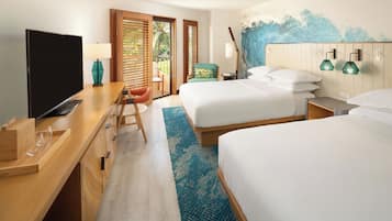 A hotel room with two beds, a TV, a desk with a laptop, and a balcony with a view of palm trees.