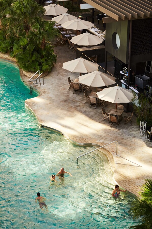 Outdoor pool, open 7:00 AM to 7:00 PM, free cabanas, pool umbrellas