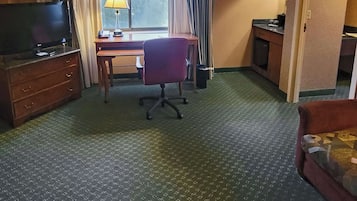 Premium bedding, desk, laptop workspace, iron/ironing board