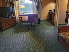 Premium bedding, desk, laptop workspace, iron/ironing board