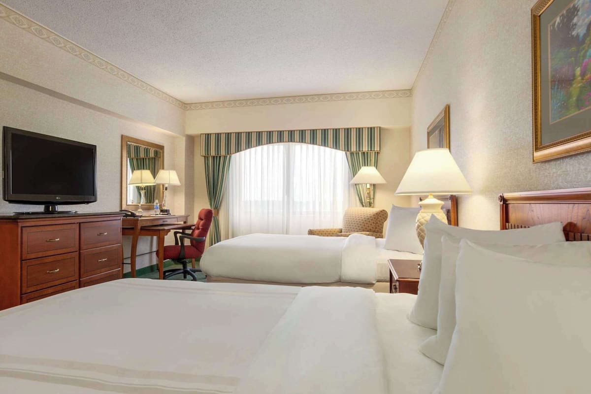 Premium bedding, desk, laptop workspace, iron/ironing board