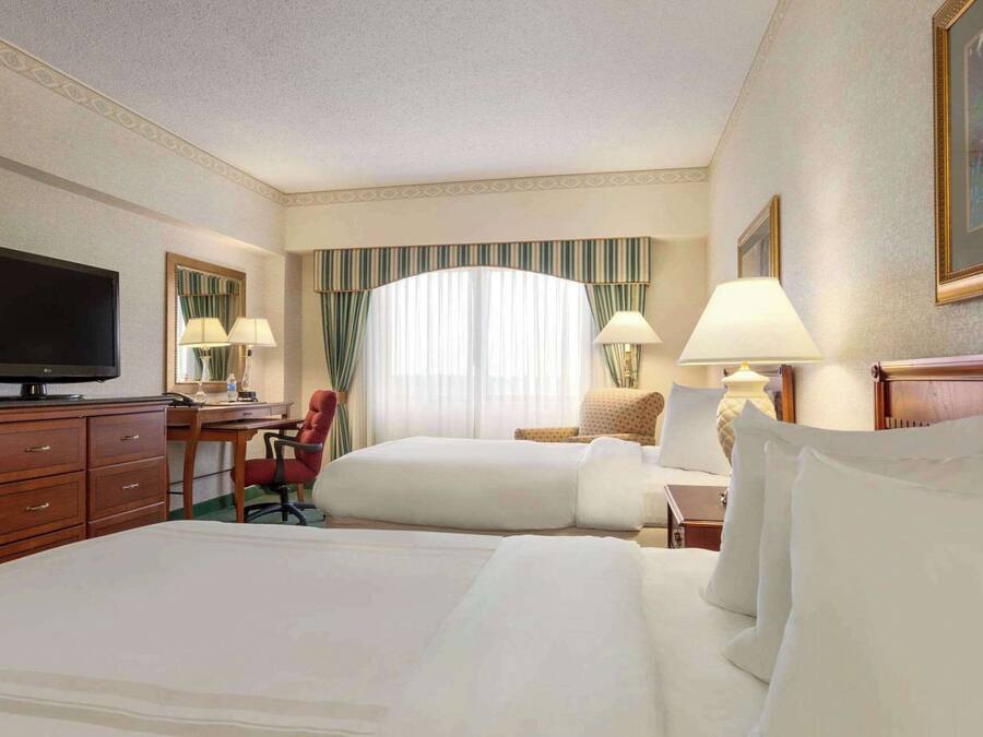 Premium bedding, desk, laptop workspace, iron/ironing board