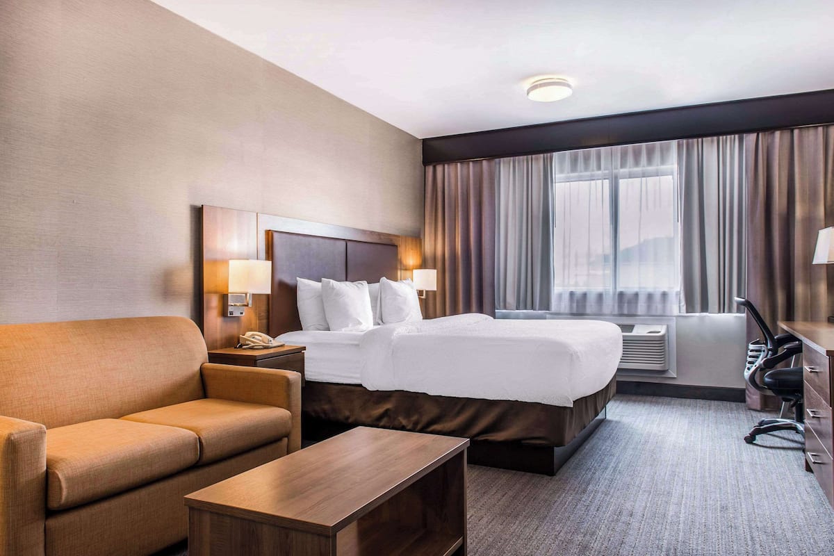 room, 1 king bed, non smoking | in-room safe, desk, iron/ironing board, free cots/infant beds