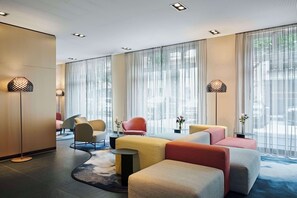 Relax in our stylish lobby with comfortable seating, large windows, and a beautiful patterned ceiling.