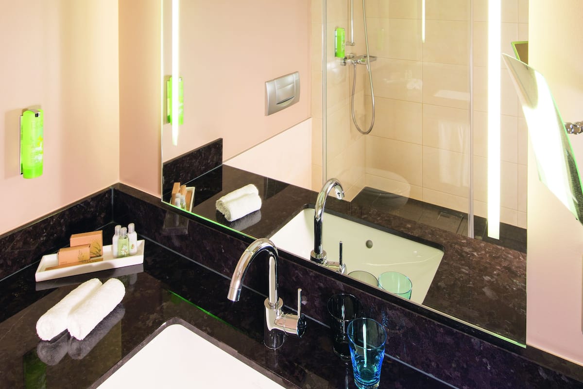 eco-friendly toiletries, hair dryer, bathrobes, slippers