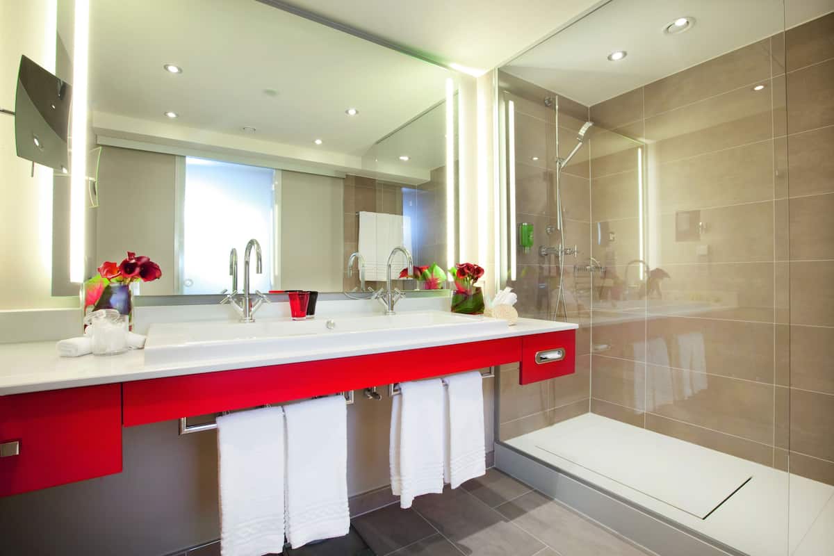 swiss suite 1 bedroom | bathroom | eco-friendly toiletries, hair dryer, bathrobes, slippers