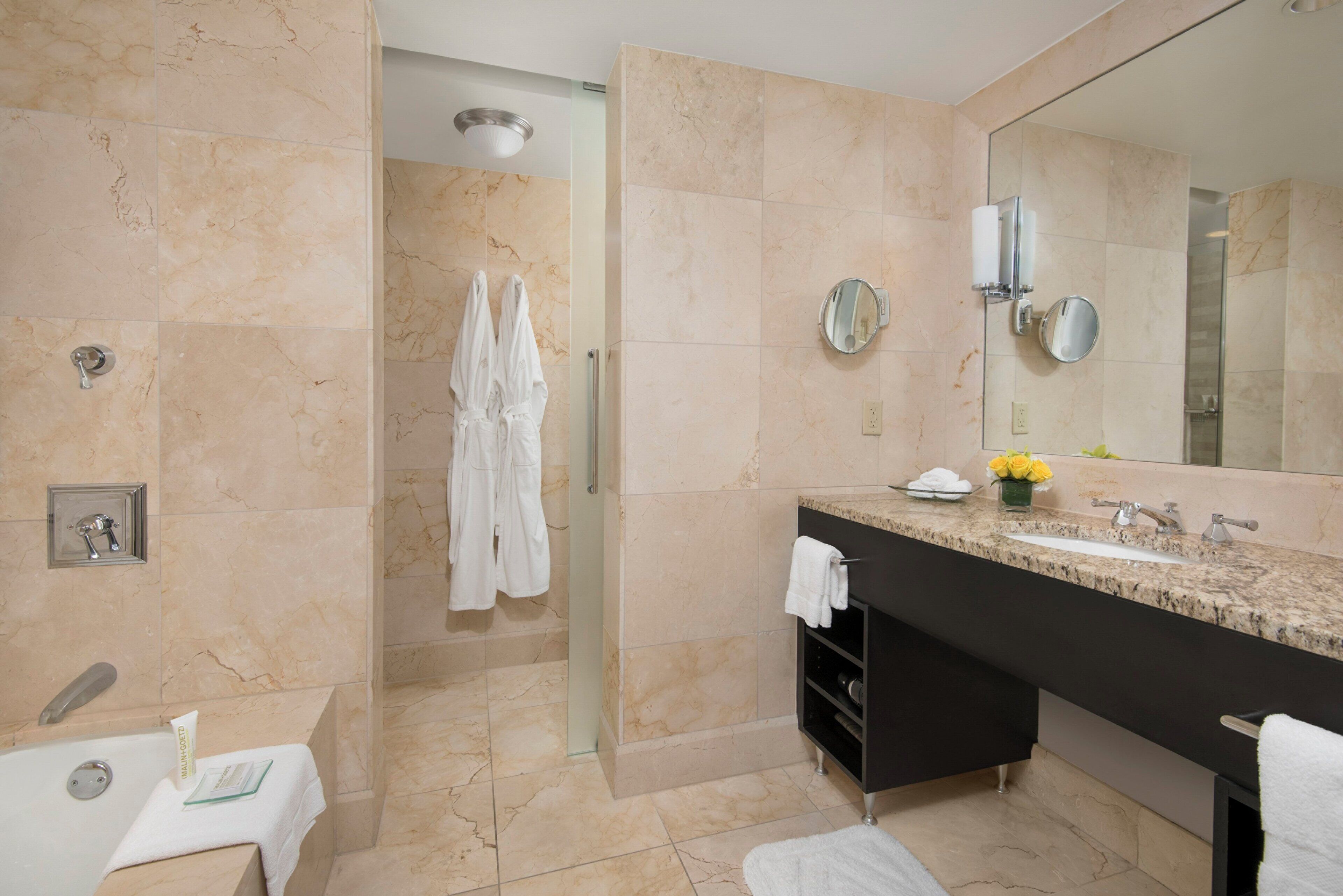 designer toiletries, hair dryer, bathrobes, slippers