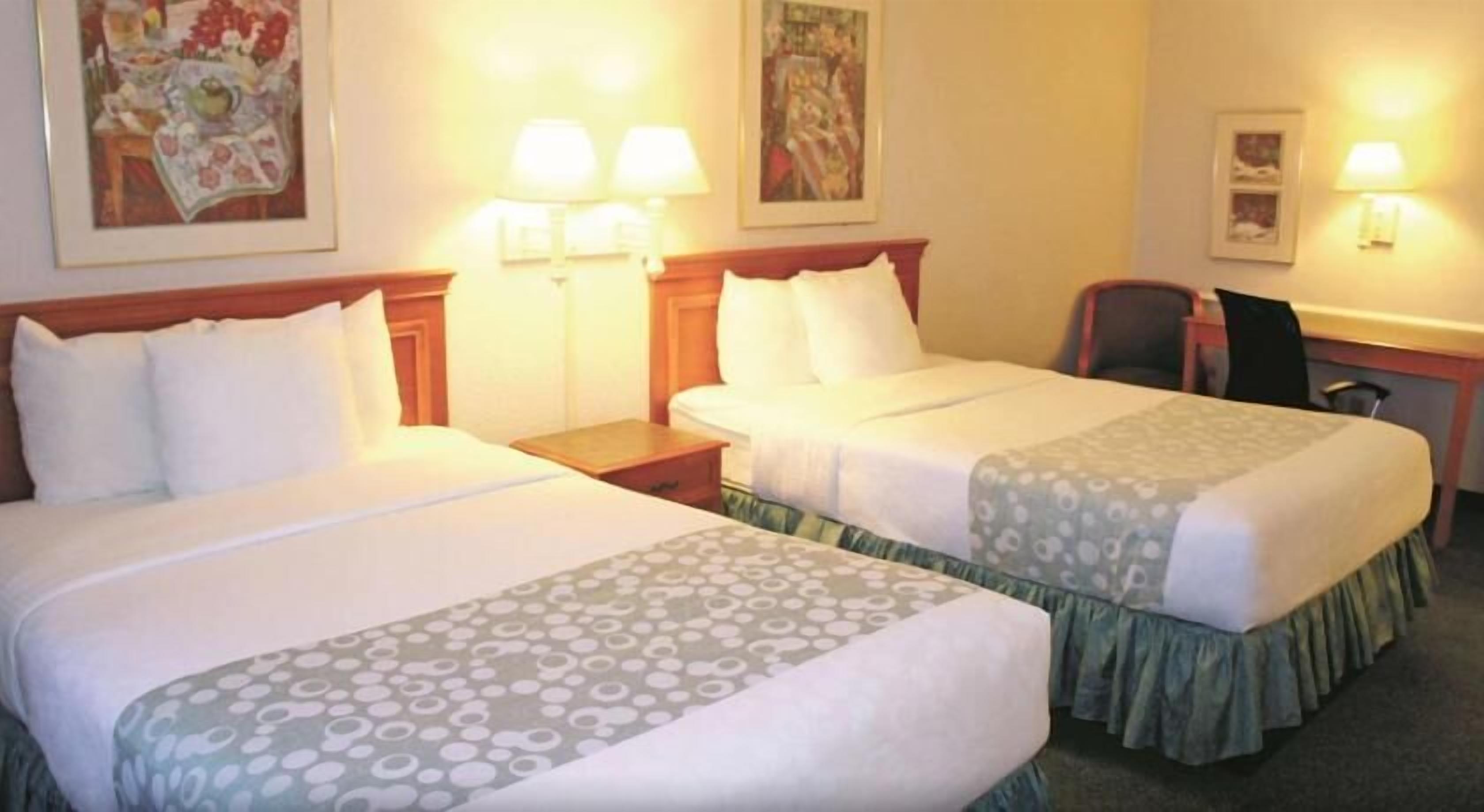 Premium bedding, desk, iron/ironing board, free cribs/infant beds