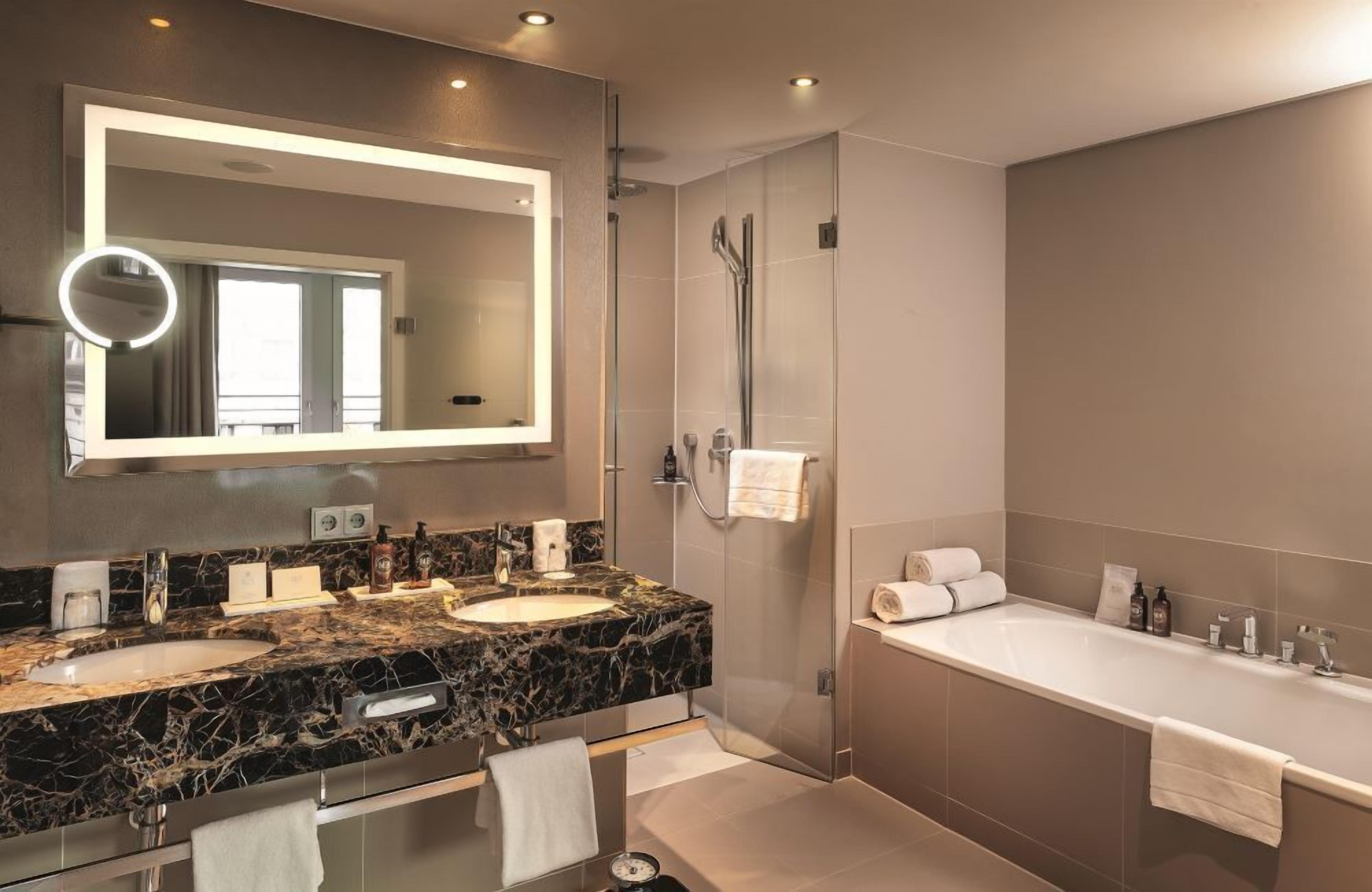 suite | bathroom | designer toiletries, hair dryer, bathrobes, slippers