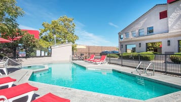 Seasonal outdoor pool, open 9:00 AM to 10 PM, pool umbrellas