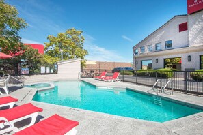 Seasonal outdoor pool, open 9:00 AM to 10 PM, pool umbrellas