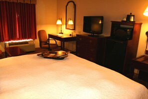 Desk, laptop workspace, blackout drapes, iron/ironing board