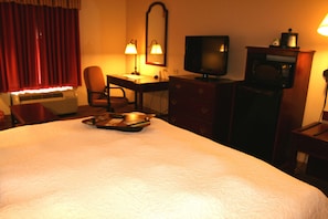 Desk, laptop workspace, blackout drapes, iron/ironing board