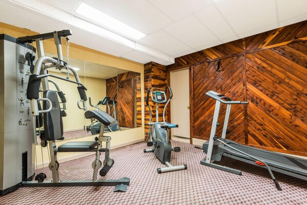 Work out in style with a fully equipped gym featuring a multi-functional workout station, elliptical trainer, and treadmill.