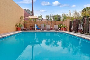 Outdoor pool, open 9 AM to 10 PM, pool umbrellas, sun loungers