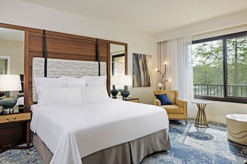 Hotel amenities such as safe, desk and work area at The Woodlands Resort, Curio Collection by Hilton