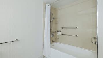 A bathroom with a bathtub, a shower, and a toilet.