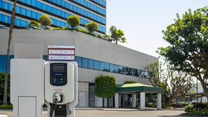 A noodles charging station in a parking lot with a Holiday Inn hotel in the background. - Holiday Inn Los Angeles Gateway - Torrance by IHG (Torrance)