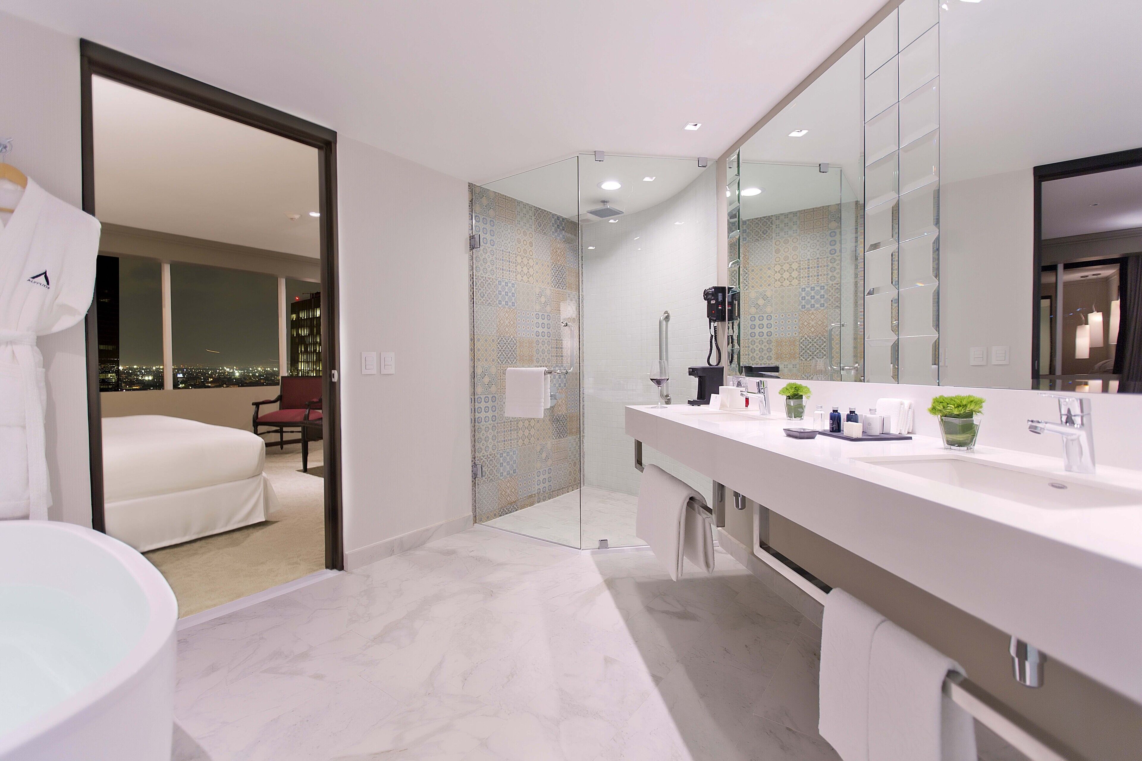 suite premium level | bathroom | shower, rainfall showerhead, eco-friendly toiletries, hair dryer