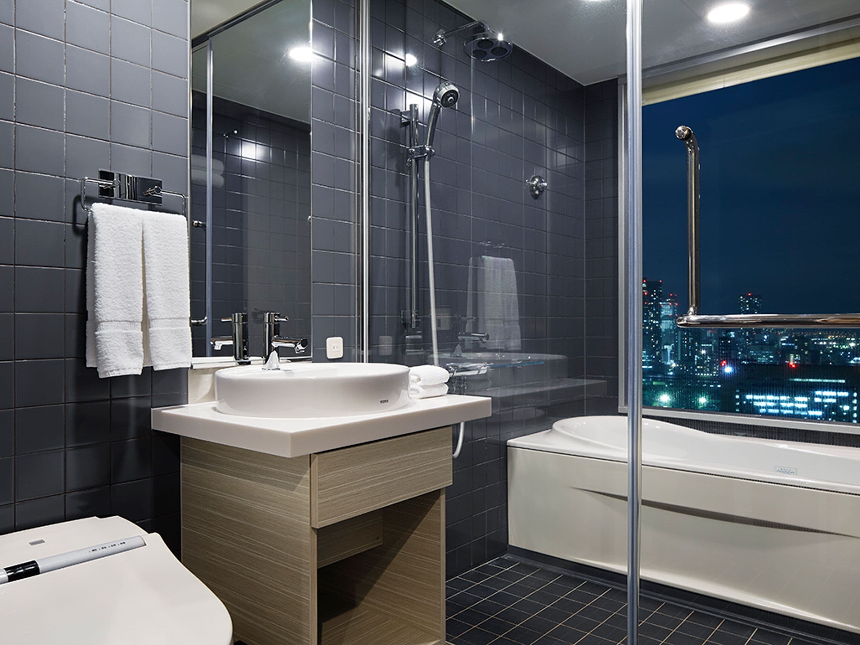 Separate bathtub and shower, free toiletries, hair dryer, slippers