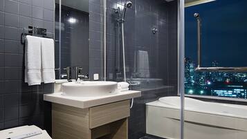 Separate bathtub and shower, free toiletries, hair dryer, slippers