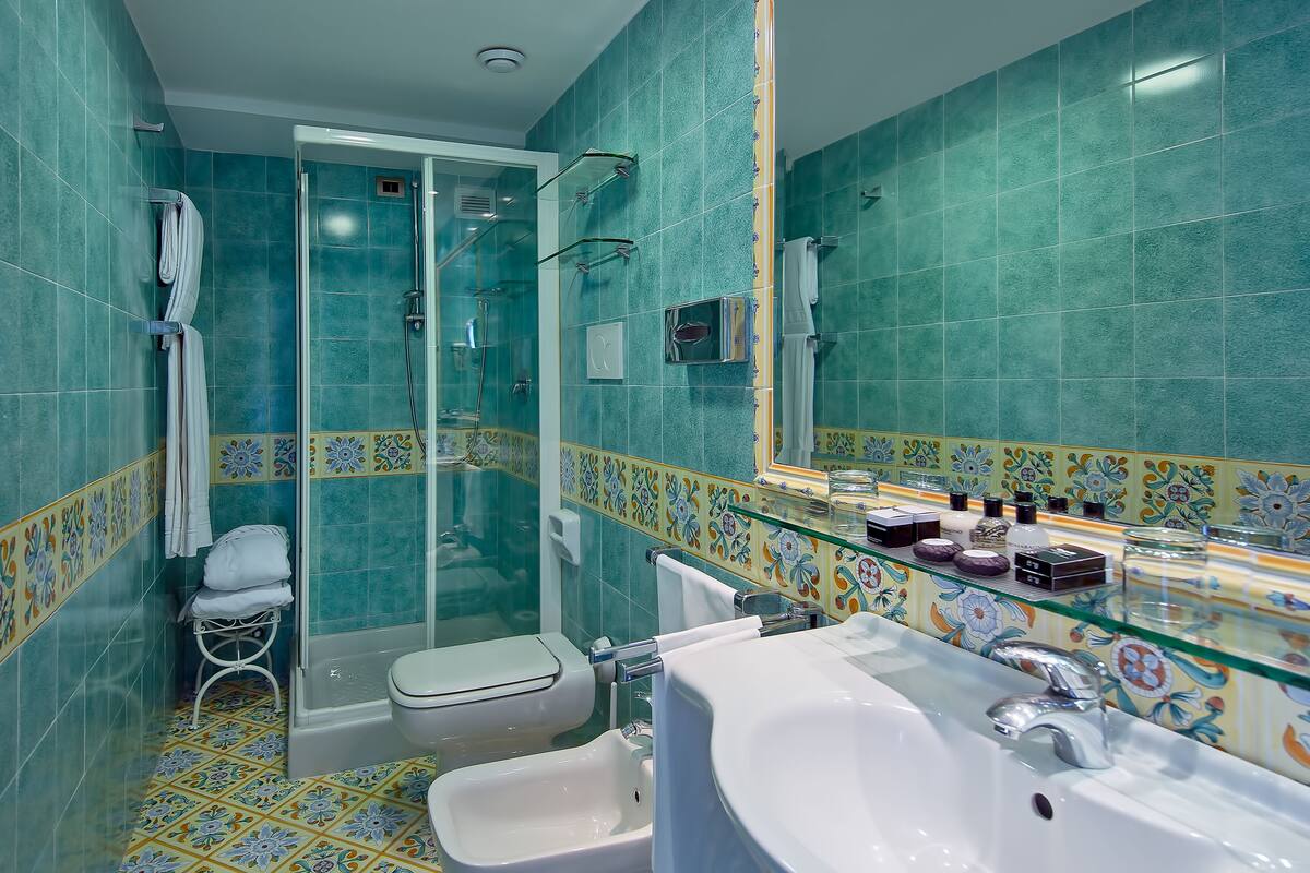 hair dryer, bathrobes, slippers, bidet