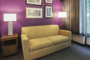 Premium bedding, desk, laptop workspace, blackout drapes
