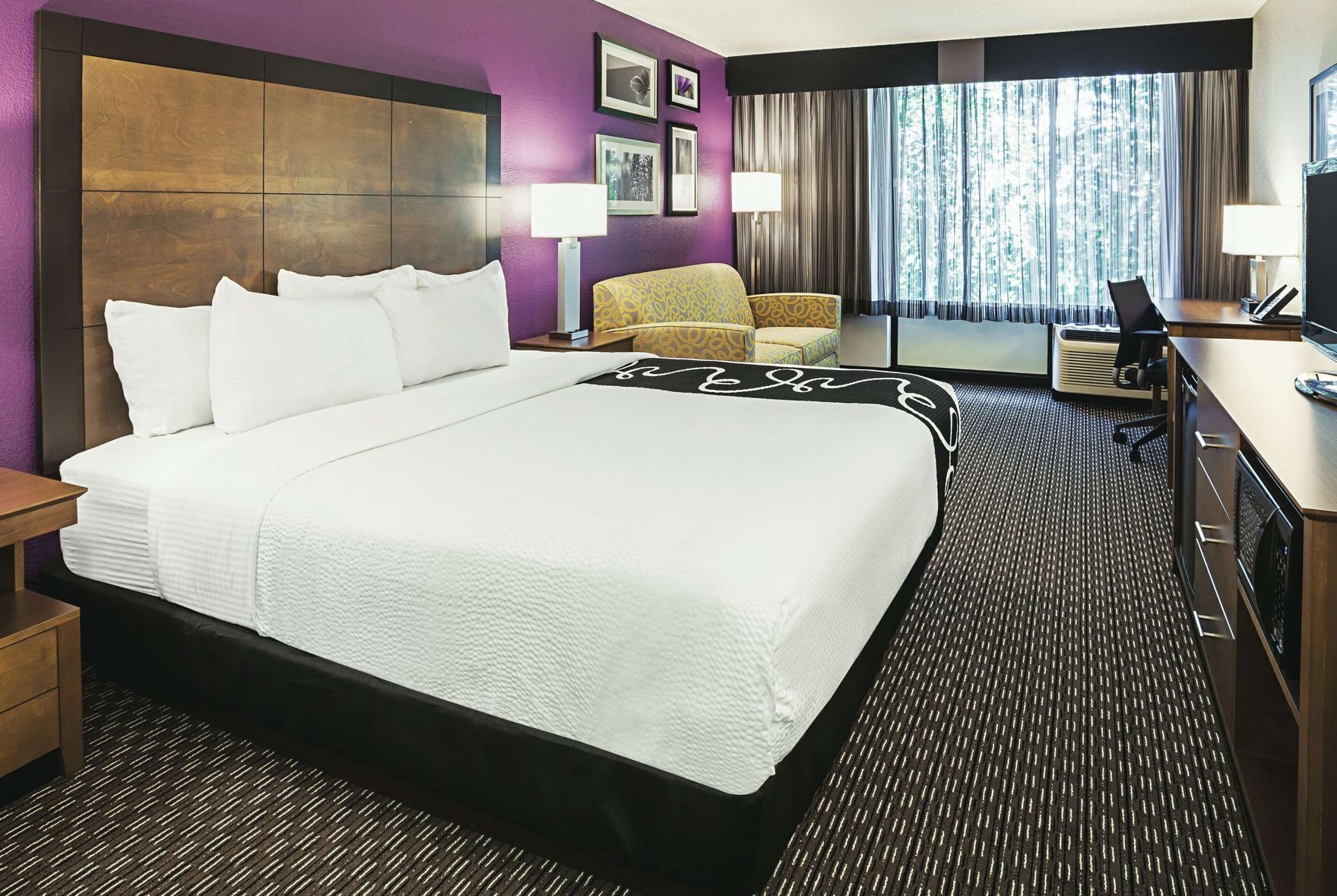 Premium bedding, desk, laptop workspace, blackout curtains