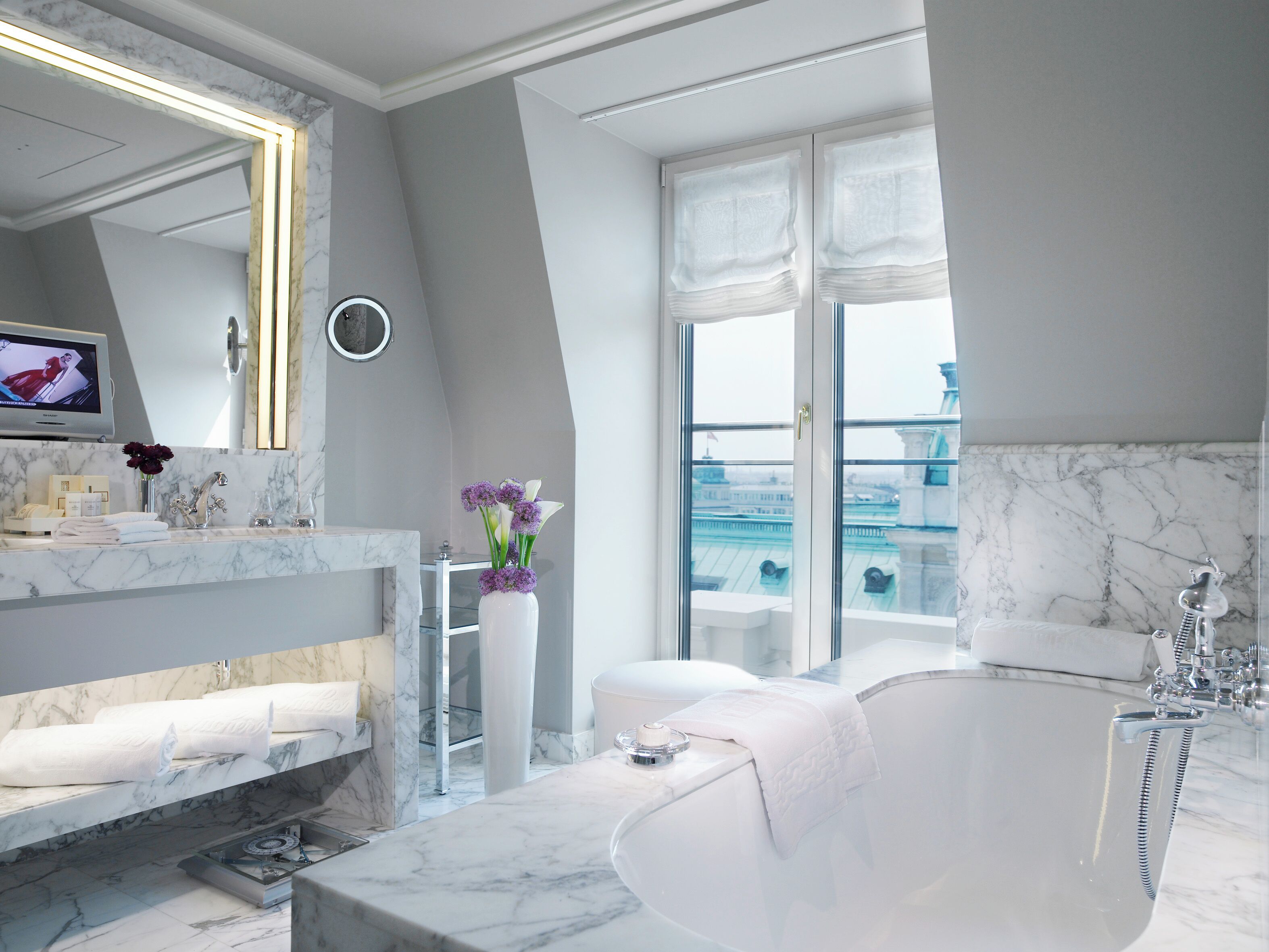 separate bathtub and shower, rainfall showerhead, designer toiletries