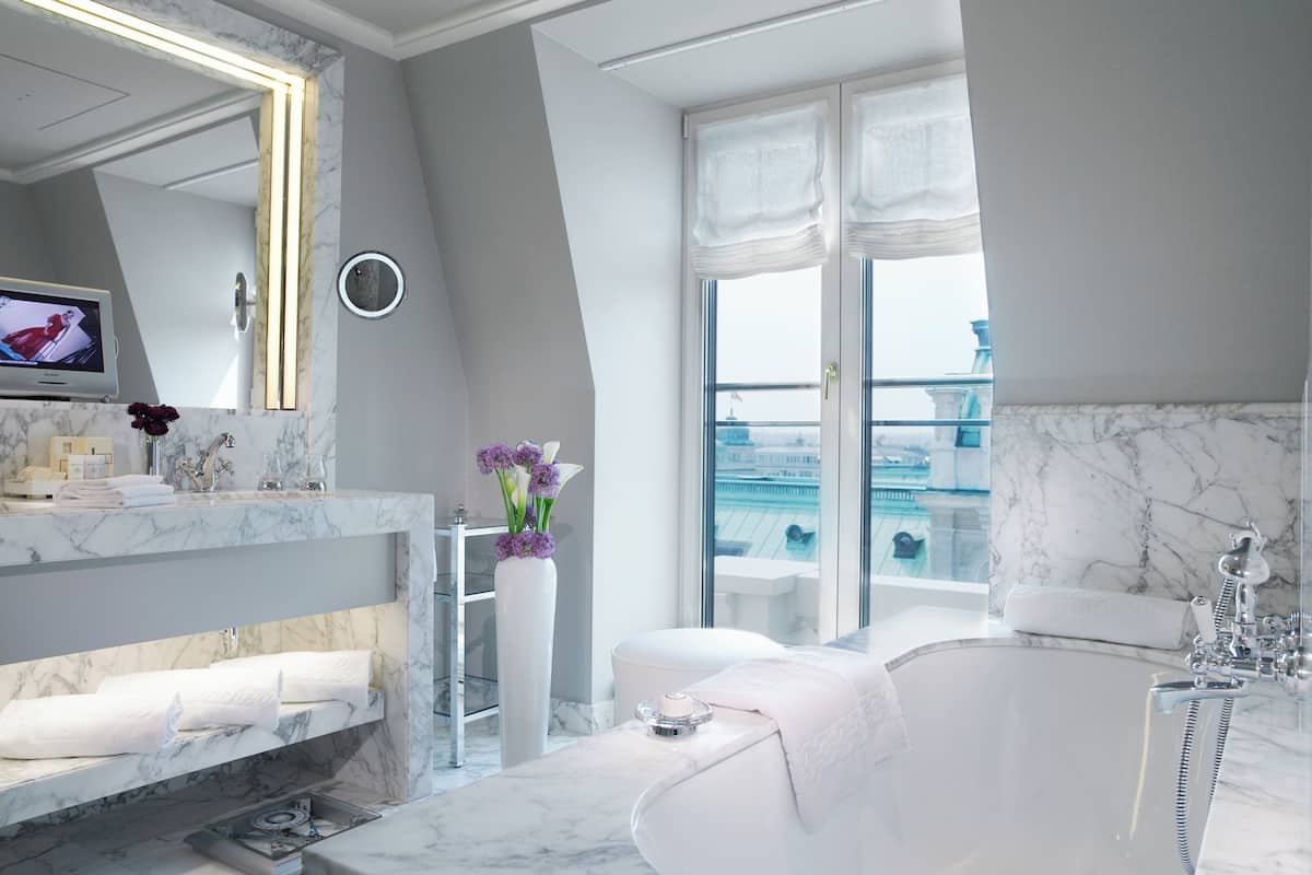 separate bathtub and shower, rainfall showerhead, designer toiletries