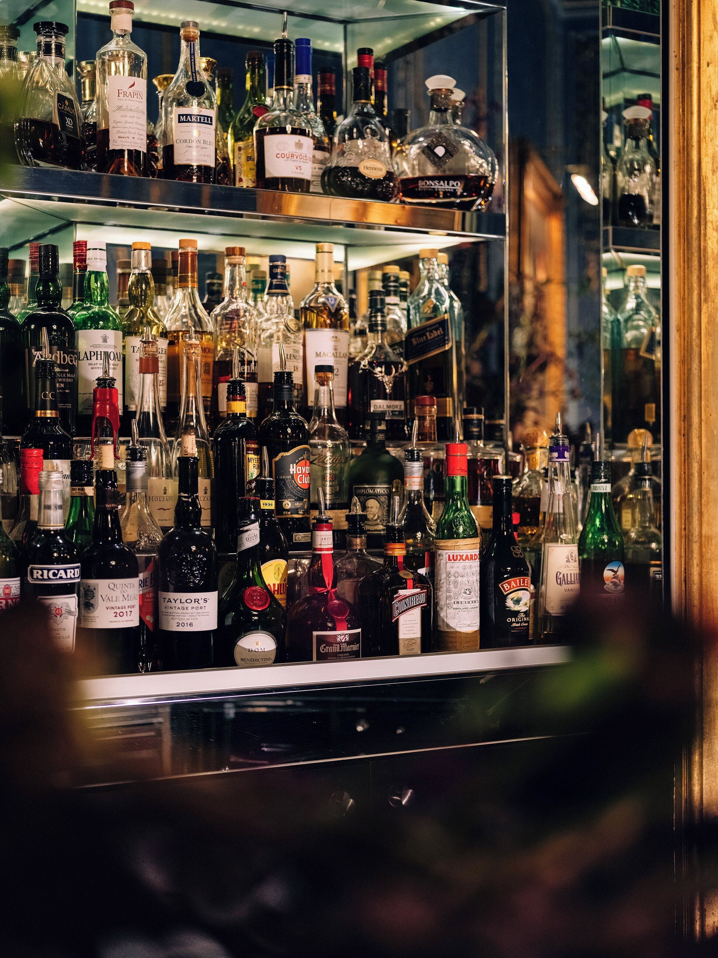 A bar stocked with various liquor bottles.